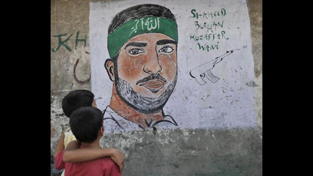 A month after Wani’s killing, his face started appearing on walls as graffiti. Educated and media savvy, Wani powered a huge recruitment drive for the militant group through videos posted online, attracting similarly minded, young and educated youth to the decades-old fight for independence of the disputed region. (Waseem Andrabi / HT Photo) A month after Wani’s killing, his face started appearing on walls as graffiti. Educated and media savvy, Wani powered a huge recruitment drive for the militant group through videos posted online, attracting similarly minded, young and educated youth to the decades-old fight for independence of the disputed region. (Waseem Andrabi / HT Photo)
