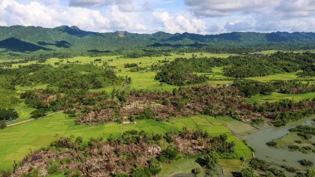 This file photo taken on October 10, 2017 shows the remains of burnt villages near Maungdaw in Northern Rakhine State. India and Myanmar signed a MoU to develop Rakhine State, from where thousands of Rohingya Muslims have fled to Bangladesh following a military crackdown.(AFP File Photo)