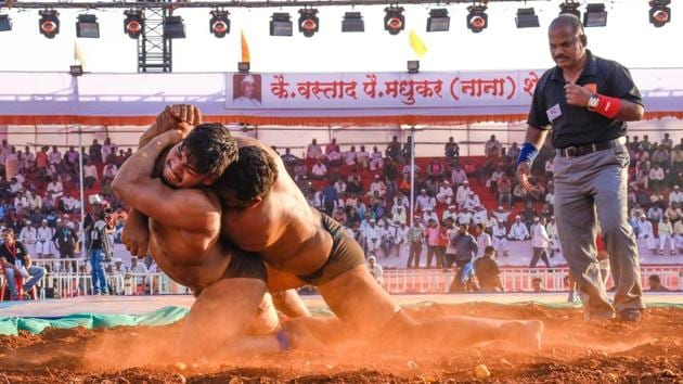 A wrestler tries to defend his stand while his opponent tries to take him down to score a point. (Sanket Wankhade/HT PHOTO) A wrestler tries to defend his stand while his opponent tries to take him down to score a point. (Sanket Wankhade/HT PHOTO)