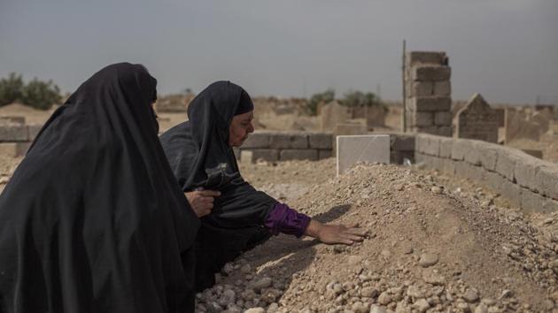 Fatima Ahmed Aswad cries as she touches the grave of her 15-year-old daughter Sana in Mosul on Oct. 9, 2017. Like many civilians killed during the final battle to drive out Islamic State extremists, Sana’s death was not recorded until her body could be exhumed. An AP investigation found between 9,000 and 11,000 civilians died during the final battle to drive out Islamic State extremists. (AP Photo) Fatima Ahmed Aswad cries as she touches the grave of her 15-year-old daughter Sana in Mosul on Oct. 9, 2017. Like many civilians killed during the final battle to drive out Islamic State extremists, Sana’s death was not recorded until her body could be exhumed. An AP investigation found between 9,000 and 11,000 civilians died during the final battle to drive out Islamic State extremists. (AP Photo)