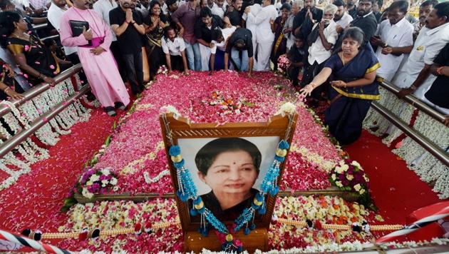 People pay their respects to the late AIADMK supremo and former chief minister J Jayalalithaa on her first death anniversary at her memorial at Marina Beach in Chennai on Tuesday. (PTI) People pay their respects to the late AIADMK supremo and former chief minister J Jayalalithaa on her first death anniversary at her memorial at Marina Beach in Chennai on Tuesday. (PTI)