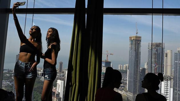 There’s always time for a selfie, especially as models wait for their turn at the auditions. (Satyabrata Tripathy/HT Photo) 
