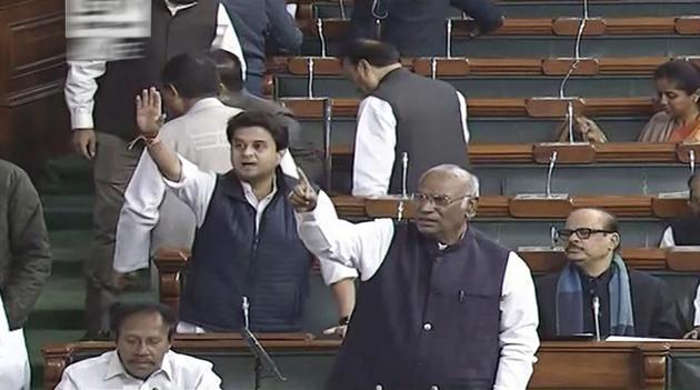 Congress members Mallikarjun Kharge, Jyotiraditya Scindia and others protest in the Lok Sabha on Wednesday, during the ongoing winter session of Parliament. (PTI Photo / TV GRAB) Congress members Mallikarjun Kharge, Jyotiraditya Scindia and others protest in the Lok Sabha on Wednesday, during the ongoing winter session of Parliament. (PTI Photo / TV GRAB)