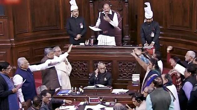 Congress members disrupt proceedings in Rajya Sabha on Wednesday, during the ongoing winter session of Parliament. (PTI) Congress members disrupt proceedings in Rajya Sabha on Wednesday, during the ongoing winter session of Parliament. (PTI)