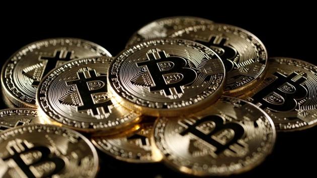 A collection of Bitcoin (virtual currency) tokens are displayed in this picture illustration taken December 8. (Reuters F) A collection of Bitcoin (virtual currency) tokens are displayed in this picture illustration taken December 8. (Reuters F)