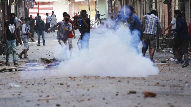 Kashmiri protesters throw stones at police during clashes on July 10, 2016 in Srinagar. Security forces regarded Wani as the brains behind several attacks on them while Wani himself had threatened to target them. (Waseem Andrabi / HT Photo) Kashmiri protesters throw stones at police during clashes on July 10, 2016 in Srinagar. Security forces regarded Wani as the brains behind several attacks on them while Wani himself had threatened to target them. (Waseem Andrabi / HT Photo)
