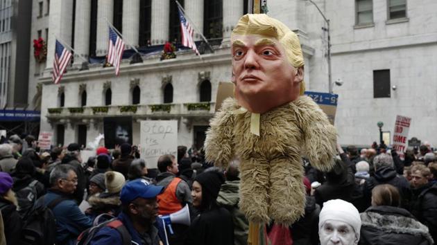 A man holds up an effigy of US President Donald Trump during a protest against the tax overhaul plan, in front of the New York Stock Exchange, December 19. (AP Photo) A man holds up an effigy of US President Donald Trump during a protest against the tax overhaul plan, in front of the New York Stock Exchange, December 19. (AP Photo)