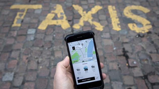 A photo illustration shows the Uber app on a mobile telephone, as it is held up for a posed photograph, in London, Britain. (Reuters File Photo) A photo illustration shows the Uber app on a mobile telephone, as it is held up for a posed photograph, in London, Britain. (Reuters File Photo)