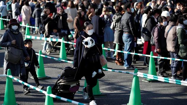 Visitors leave Xiang Xiang’s enclosure after a public viewing at Ueno Zoo in Tokyo. Hundreds of fans thronged for a glimpse of the cub, decorating themselves with panda motifs. (Issei Kato / REUTERS) Visitors leave Xiang Xiang’s enclosure after a public viewing at Ueno Zoo in Tokyo. Hundreds of fans thronged for a glimpse of the cub, decorating themselves with panda motifs. (Issei Kato / REUTERS)