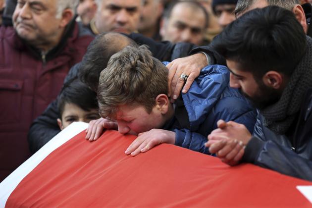 Family and friends mourn on January 1, 2017, during the funeral for Ayhan Akin, a victim of a shooting at a nightclub in Istanbul.(AP)