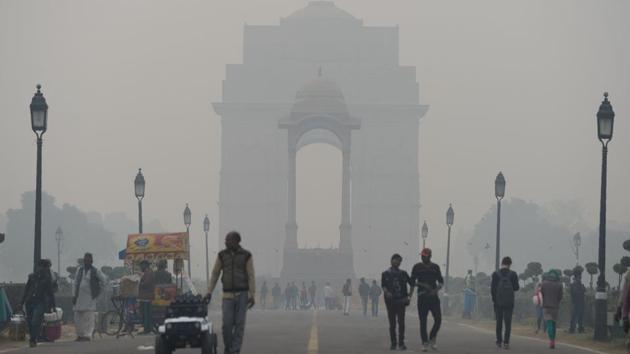 People walk amid heavy smog at the India Gate in New Delhi. (AFP) People walk amid heavy smog at the India Gate in New Delhi. (AFP)