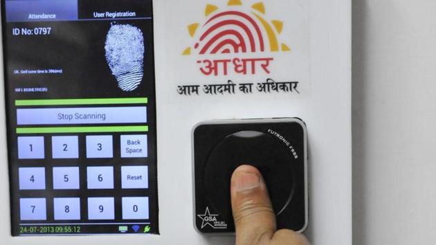 Employees mark their attendance through Aadhaar based System at a government office. (File photo) Employees mark their attendance through Aadhaar based System at a government office. (File photo)