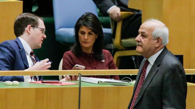 Riyad H. Mansour, (R) Palestine's Ambassador to the United Nations walks pass by US Ambassador to the UN Nikki Haley as he attends the General Assembly for the vote on Jerusalem, on December 15, 2017, at UN Headquarters in New York.(AFP Photo)