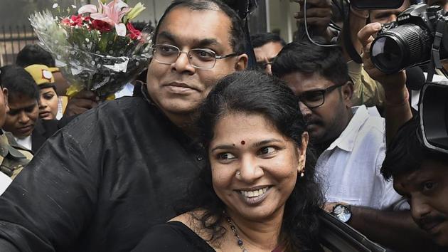 DMK MP Kanimozhi celebrates with along her husband G Aravindan after she was acquitted by a special court in the 2G scam case, in New Delhi on Thursday.(PTI Photo)