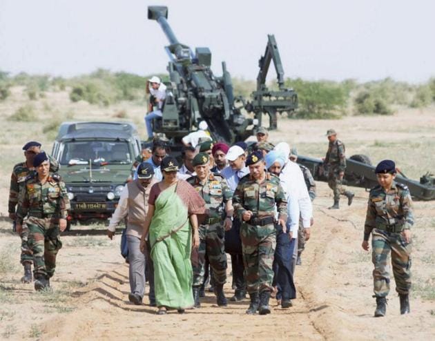 A file photo shows defence minister Nirmala Sitharaman with the army chief General Bipin Rawat and other officers after witnessing firing of ATAGS at Pokhran in Rajasthan in September.(PTI FILE PHOTO)