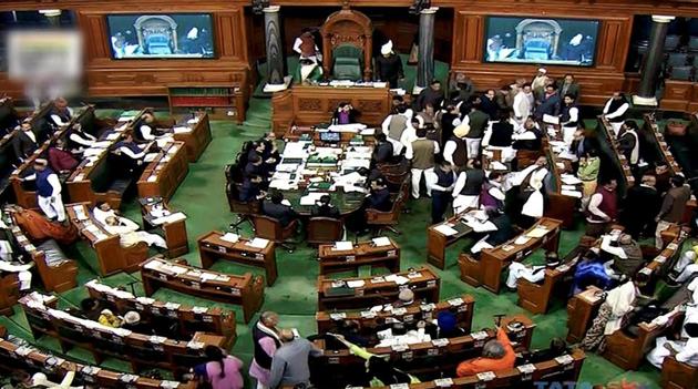 Congress members disrupt the proceedings in Lok Sabha in New Delhi during the ongoing winter session of Parliament. (PTI.TV GRAB) Congress members disrupt the proceedings in Lok Sabha in New Delhi during the ongoing winter session of Parliament. (PTI.TV GRAB)