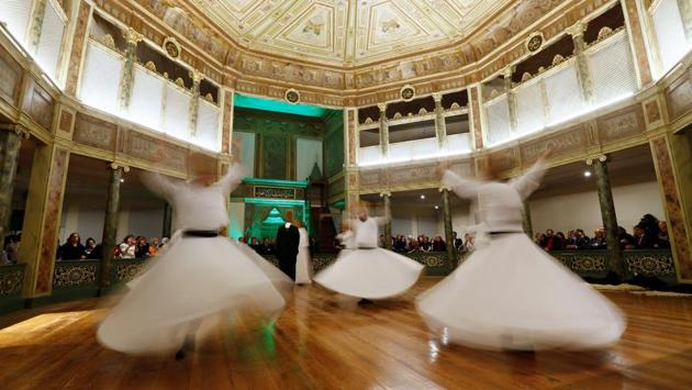 Arms crossed over their hearts, hands resting on their shoulders, the dervishes start their dance. They turn on themselves, slowly sliding their hands along their bodies before raising them, embracing the universe. But far from being only an act of introvert worship, the dance of the whirling dervishes is now a huge draw in Turkey, attracting thousands of tourists every year. (Murad Sezer / REUTERS) Arms crossed over their hearts, hands resting on their shoulders, the dervishes start their dance. They turn on themselves, slowly sliding their hands along their bodies before raising them, embracing the universe. But far from being only an act of introvert worship, the dance of the whirling dervishes is now a huge draw in Turkey, attracting thousands of tourists every year. (Murad Sezer / REUTERS)