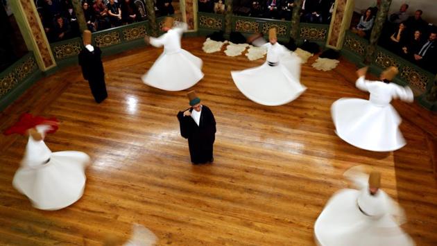 The audience watched entranced at a dance which copies the movement of planets against a background of Sufi music. “When we say Konya, we think of Mevlana and when we say Mevlana, Konya comes to mind,” Abdussettar Yarar, director of Konya Culture and Tourism said. (Murad Sezer / REUTERS) The audience watched entranced at a dance which copies the movement of planets against a background of Sufi music. “When we say Konya, we think of Mevlana and when we say Mevlana, Konya comes to mind,” Abdussettar Yarar, director of Konya Culture and Tourism said. (Murad Sezer / REUTERS)