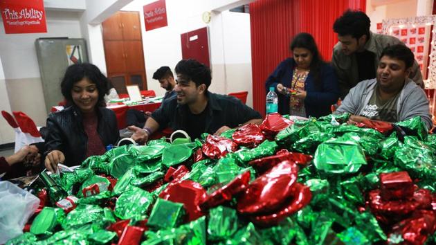 Volunteers at the workshop packing gifts. (Amal KS/HT Photo) Volunteers at the workshop packing gifts. (Amal KS/HT Photo)