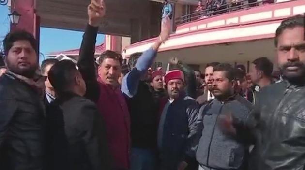 Supporters of Prem Kumar Dhumal raise slogans in his favour outside the venue of the core committee meeting in Shimla on Friday. (ANI Twitter) Supporters of Prem Kumar Dhumal raise slogans in his favour outside the venue of the core committee meeting in Shimla on Friday. (ANI Twitter)