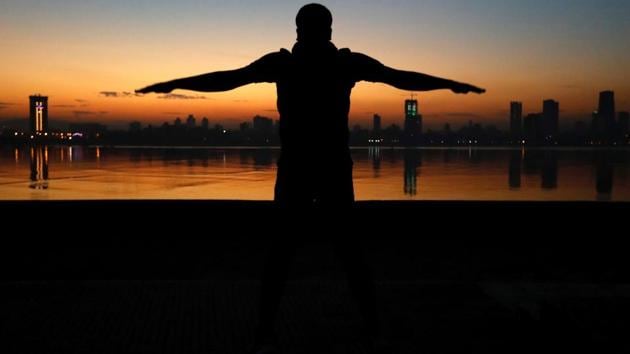 A man exercises early in the morning along the Arabian Sea in Mumbai on Thursday. (Danish Siddiqui / REUTERS)