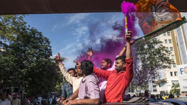 Bharatiya Janata Party workers celebrate after the BJP won the Gujarat Assembly Elections 2017 in Ahmedabad on Monday. The BJP won 99 seats in the 182-member assembly and the Congress, 77. (Satish Bate / HT Photo)