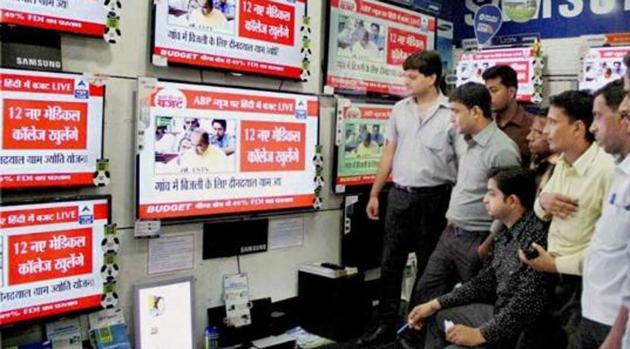 People in Allahabad watch a live telecast on TV. (PTI photo / Representative Image) People in Allahabad watch a live telecast on TV. (PTI photo / Representative Image)