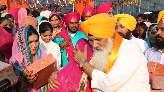 Match-maker: Bhai Balwinder Singh Rangila blesses a girl at mass marriage ceremony; (right) at his house in Sector 40, Chandigarh.(Sikander Singh/HT)
