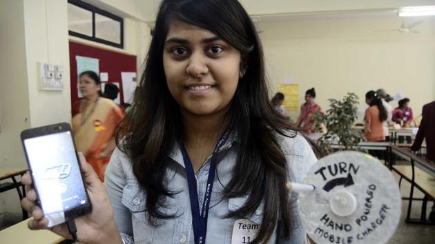 Sanika Patil, a participant of Marathwada Mitra Mandal’s Junior College of Commerce and Science’s intercollegiate science exhibition, with her hand-held mobile charger. (Ravindra Joshi/HT PHOTO) Sanika Patil, a participant of Marathwada Mitra Mandal’s Junior College of Commerce and Science’s intercollegiate science exhibition, with her hand-held mobile charger. (Ravindra Joshi/HT PHOTO)