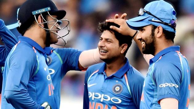 MS Dhoni and Rohit Sharma share a laugh with Kuldeep Yadav (centre) during the 3rd and final ODI cricket match in Visakhapatnam on December 17, 2017. MS Dhoni is only three catches away from becoming the first wicketkeeper to complete a half-century of catches in T20 Internationals.(PTI)