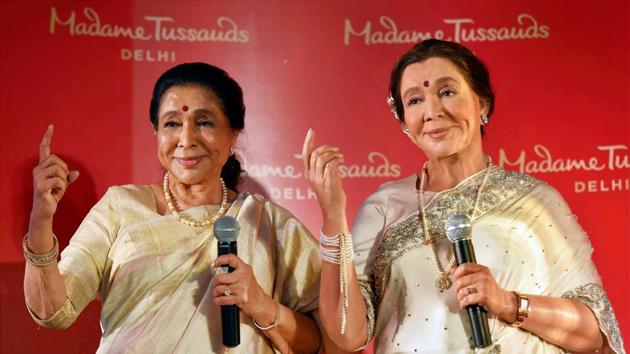 Singer Asha Bhosle poses with her wax statue during its unveiling at Madame Tussauds in New Delhi. (PTI file photo) Singer Asha Bhosle poses with her wax statue during its unveiling at Madame Tussauds in New Delhi. (PTI file photo)
