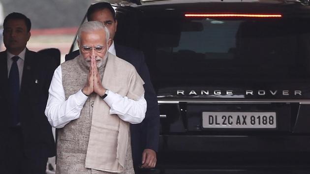 Prime Minister Narendra Modi gestures as he walks to speak with the media after arriving at the Parliament House on December 15. (Reuters File) Prime Minister Narendra Modi gestures as he walks to speak with the media after arriving at the Parliament House on December 15. (Reuters File)