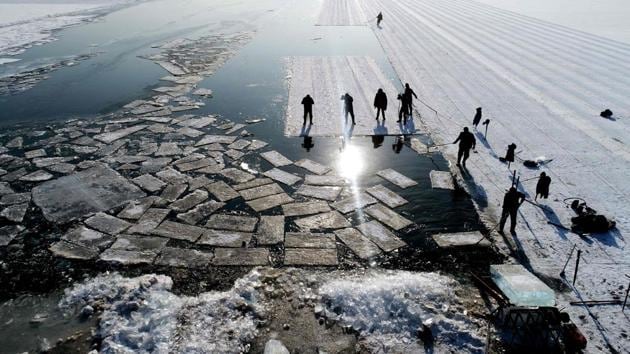 An aerial view shows floating ice blocks cut from the frozen surface of Xiuhu lake in Shenyang, China on December 20, 2017. The ice blocks are used as part of winter tourism activities in the region. (AFP) An aerial view shows floating ice blocks cut from the frozen surface of Xiuhu lake in Shenyang, China on December 20, 2017. The ice blocks are used as part of winter tourism activities in the region. (AFP)