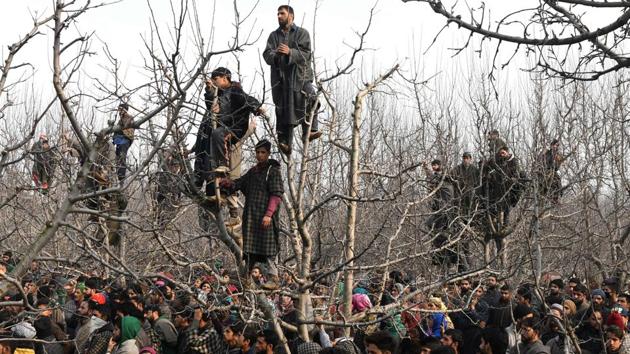 Kashmiri villagers look on during the funeral procession of militant Tanveer Ahmed at Batmurran Kellar village in Shopian. (Tauseef Mustafa / AFP)