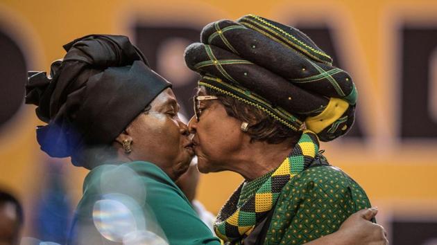 The former wife of Nelson Mandela, Winnie Mandela (R), and candidate for the African National Congress presidency and ex-wife of incumbent South African president, Nkosazana Dlamini-Zuma greet each other as they attend the 54th ANC National Conference at the NASREC Expo Centre in Johannesburg on December 16, 2017. (Mujahid Safodien / AFP) The former wife of Nelson Mandela, Winnie Mandela (R), and candidate for the African National Congress presidency and ex-wife of incumbent South African president, Nkosazana Dlamini-Zuma greet each other as they attend the 54th ANC National Conference at the NASREC Expo Centre in Johannesburg on December 16, 2017. (Mujahid Safodien / AFP)