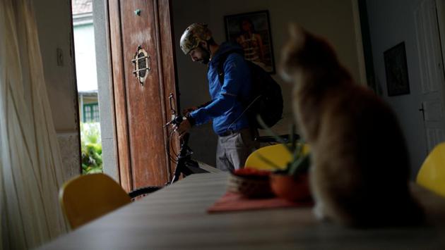 Bruno Fernandes, 33, a member of the Municipal Theatre Ballet Corps, leaves home to go to a ballet class. "It's gotten to the point that, it's funny to say, I don't even have money for a bus ticket. I could pay my basic bills and feed myself or I could pay for the bus," said Fernandes. (Ricardo Moraes / REUTERS) Bruno Fernandes, 33, a member of the Municipal Theatre Ballet Corps, leaves home to go to a ballet class. "It's gotten to the point that, it's funny to say, I don't even have money for a bus ticket. I could pay my basic bills and feed myself or I could pay for the bus," said Fernandes. (Ricardo Moraes / REUTERS)