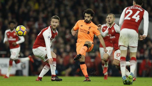 Liverpool's Mohamed Salah shoots and scores during his side’s Premier League match against Arsenal. (AP) Liverpool's Mohamed Salah shoots and scores during his side’s Premier League match against Arsenal. (AP)