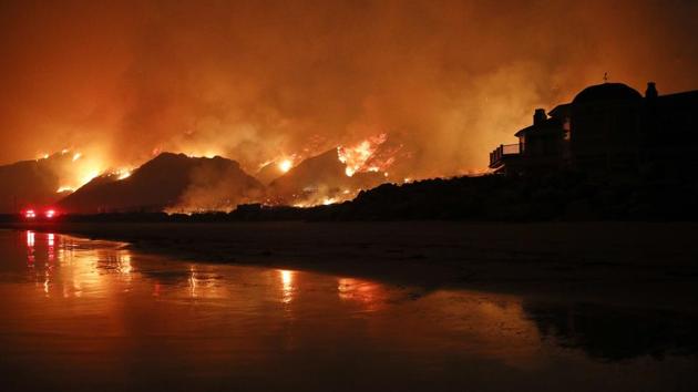 In this December 5, a wildfire burns along the 101 Freeway in Ventura, California. (AP Photo)