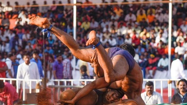 A wrestler makes a swift move to topple over his opponent to score a point. (Sanket Wankhade/HT PHOTO) A wrestler makes a swift move to topple over his opponent to score a point. (Sanket Wankhade/HT PHOTO)
