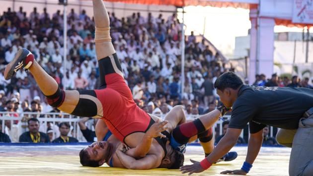 Wrestlers battle it out on the mat . (Sanket Wankhade/HT PHOTO) Wrestlers battle it out on the mat . (Sanket Wankhade/HT PHOTO)