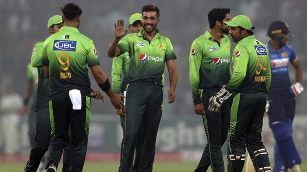 Pakistan's Mohammad Amir, center, celebrates with teammates after taking the wicket of Sri Lankan batsman Dilshan Munaweera during their third Twenty20 international match at the Gaddafi stadium in Lahore on Oct. 29, 2017. Amir has been picked for the tour in New Zealand. (AP) Pakistan's Mohammad Amir, center, celebrates with teammates after taking the wicket of Sri Lankan batsman Dilshan Munaweera during their third Twenty20 international match at the Gaddafi stadium in Lahore on Oct. 29, 2017. Amir has been picked for the tour in New Zealand. (AP)