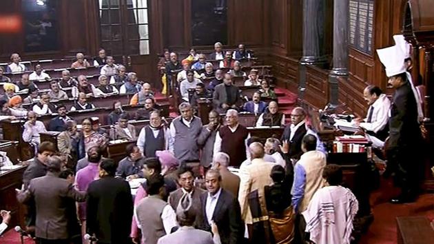 Opposition members protest inside the Rajya Sabha in New Delhi on Thursday during the ongoing winter session of Parliament. (TV grab/PTI) Opposition members protest inside the Rajya Sabha in New Delhi on Thursday during the ongoing winter session of Parliament. (TV grab/PTI)