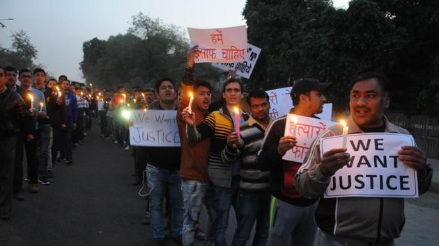 Family members and relatives of Sunil Bhatt hold candle light march in Gurgaon on Sunday. Family members and relatives of Sunil Bhatt hold candle light march in Gurgaon on Sunday.