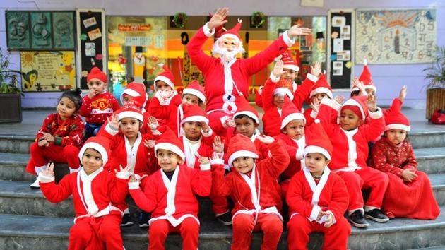 Dressed as Santa Claus, school kids pose for a photograph as they celebrate Christmas at Gian Jyoti Global School, in Mohali on Friday. (Anil Dayal/HT) Dressed as Santa Claus, school kids pose for a photograph as they celebrate Christmas at Gian Jyoti Global School, in Mohali on Friday. (Anil Dayal/HT)