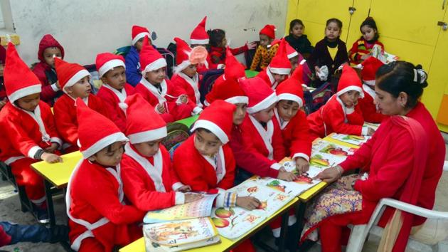 Dressed as Santa Claus, school kids attend class ahead of Christmas day celebrations at Jagat Jyoti School in Amritsar on Saturday. (Sameer Sehgal/HT) Dressed as Santa Claus, school kids attend class ahead of Christmas day celebrations at Jagat Jyoti School in Amritsar on Saturday. (Sameer Sehgal/HT)