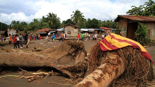 Trees uprooted by flashfloods lie in a village in Salvador, Lanao del Norte. Pope Francis said in Rome he was praying for storm victims in the Philippines, where some 80 percent of the population is Catholic. “May the merciful God welcome the souls of the dead and comfort those who suffer from this calamity,” he said. (Richel V. Umel / REUTERS) Trees uprooted by flashfloods lie in a village in Salvador, Lanao del Norte. Pope Francis said in Rome he was praying for storm victims in the Philippines, where some 80 percent of the population is Catholic. “May the merciful God welcome the souls of the dead and comfort those who suffer from this calamity,” he said. (Richel V. Umel / REUTERS)