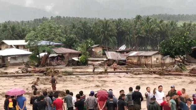 People attempt to rescue flood victims in Lanao Del Norte, Philippines. A total of 70,000 have been displaced or otherwise affected by the storm according to the International Federation of Red Cross and Red Crescent Societies (IFRC), which warned that continued heavy rain could hamper the search for survivors. (Cabugatan Disumala / REUTERS) People attempt to rescue flood victims in Lanao Del Norte, Philippines. A total of 70,000 have been displaced or otherwise affected by the storm according to the International Federation of Red Cross and Red Crescent Societies (IFRC), which warned that continued heavy rain could hamper the search for survivors. (Cabugatan Disumala / REUTERS)