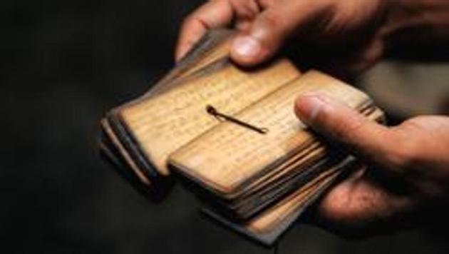 A sacred text in the hands of monk.(Getty Images/iStockphoto)