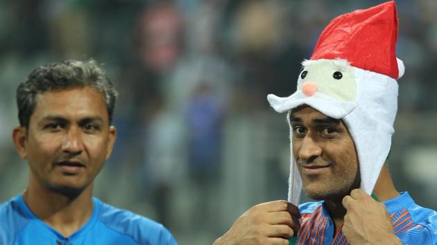 Sanjay Bangar and MS Dhoni celebrate after India’s series win over Sri Lanka. (BCCI) 