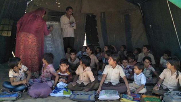A school running in tent at the flood-affected Dhorimanna block in Barmer district.(HT Photo) A school running in tent at the flood-affected Dhorimanna block in Barmer district.(HT Photo)